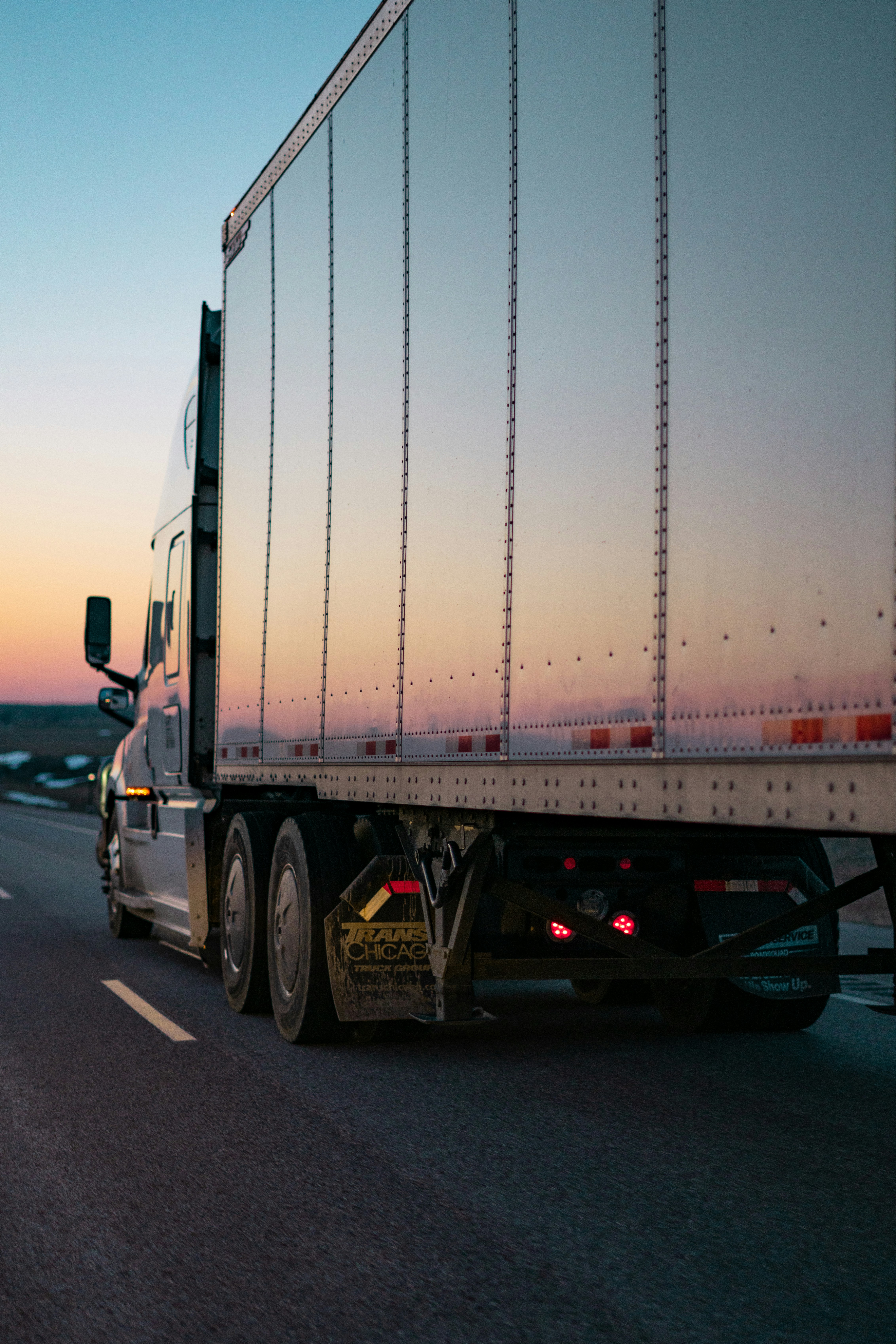Freight truck on highway at sunset